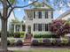 Charming two-story home with a manicured front yard, picket fence, and inviting curb appeal at 1711 Happiness Hill Ln, Raleigh, NC 27614