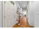 Bright foyer with hardwood floors, a staircase, and a glimpse into the home's elegant interior at 1711 Happiness Hill Ln, Raleigh, NC 27614