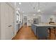 Modern kitchen with stainless steel appliances, custom cabinetry, and a large center island at 1711 Happiness Hill Ln, Raleigh, NC 27614