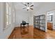 Bright home office featuring hardwood floors, large windows, and ample natural light at 1711 Happiness Hill Ln, Raleigh, NC 27614