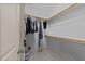 Walk-in closet with built-in shelving and clothing storage, providing ample space for organization at 1711 Happiness Hill Ln, Raleigh, NC 27614