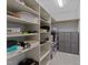 Organized walk-in closet with ample shelving and storage solutions, maximizing space at 1711 Happiness Hill Ln, Raleigh, NC 27614