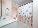 Functional bathroom with a floral shower curtain, single vanity, and tile floors at 1911 Falls Landing Dr # 106, Raleigh, NC 27614