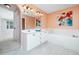 Bathroom showcasing a double vanity, soaking tub, and neutral finishes at 1911 Falls Landing Dr # 106, Raleigh, NC 27614