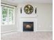 Close-up view of a cozy fireplace with decorative mantle and wall adornments at 1911 Falls Landing Dr # 106, Raleigh, NC 27614