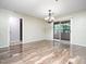 Bright living room showcasing hardwood flooring and natural light through sliding glass doors at 1911 Falls Landing Dr # 106, Raleigh, NC 27614