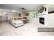 Bright living room showcasing neutral tones, a cozy fireplace, and a comfortable couch at 1911 Falls Landing Dr # 106, Raleigh, NC 27614