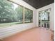 View of the screened porch with natural light and a doorway leading outside at 1911 Falls Landing Dr # 106, Raleigh, NC 27614