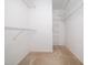 Spacious walk-in closet with shelving and plenty of room for storage at 1911 Falls Landing Dr # 106, Raleigh, NC 27614