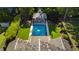 Aerial view of backyard pool, cabana, landscaping, and the home's roof at 2120 Kipawa St, Raleigh, NC 27607