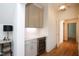 Home bar featuring gray cabinets, wine refrigerator, and a countertop at 2120 Kipawa St, Raleigh, NC 27607