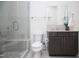 Elegant bathroom with a glass-enclosed shower, marble vanity, and contemporary fixtures at 2120 Kipawa St, Raleigh, NC 27607