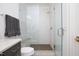 Shower with glass doors, tiled walls, and a built-in bench at 2120 Kipawa St, Raleigh, NC 27607