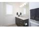 Bathroom vanity with marble countertops and towels at 2120 Kipawa St, Raleigh, NC 27607