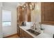 Butler's pantry with custom cabinets, granite countertops, modern faucet, and under-cabinet lighting at 2120 Kipawa St, Raleigh, NC 27607