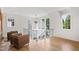 Bright open foyer with a chandelier, hardwood floors, high ceilings, and oversized windows at 2120 Kipawa St, Raleigh, NC 27607