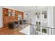 Bright open foyer with a chandelier, built-in shelving, hardwood floors, and oversized windows at 2120 Kipawa St, Raleigh, NC 27607