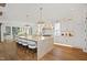 Elegant kitchen featuring a large island, modern appliances, pendant lighting, and hardwood floors at 2120 Kipawa St, Raleigh, NC 27607