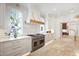 Bright and modern kitchen with custom cabinetry, stainless steel appliances, and a center island at 2120 Kipawa St, Raleigh, NC 27607