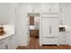 Walk-in pantry with custom cabinets, granite countertops, and stainless-steel appliances at 2120 Kipawa St, Raleigh, NC 27607