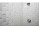 Shower with patterned tile walls, shower head and faucet at 2120 Kipawa St, Raleigh, NC 27607
