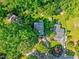 Aerial view of the property showcasing its location surrounded by lush greenery and neighboring homes at 230 Parkland Rd, Raleigh, NC 27603