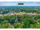 Aerial view of 230 Parkland Rd, near Crossroads Plaza, nestled in a tree-filled setting at 230 Parkland Rd, Raleigh, NC 27603