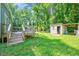 Expansive backyard with wooden deck and shed, perfect for outdoor activities and storage at 230 Parkland Rd, Raleigh, NC 27603