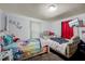 Bedroom with carpet, twin beds and neutral colored walls at 230 Parkland Rd, Raleigh, NC 27603