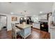 Bright kitchen features a granite-topped island and black appliances at 230 Parkland Rd, Raleigh, NC 27603