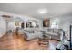 Cozy living room with hardwood floors and view of the adjacent dining room and kitchen at 230 Parkland Rd, Raleigh, NC 27603
