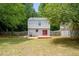 Backyard features a deck with double red doors and fenced yard at 2309 Hoot Owl Ct, Raleigh, NC 27603