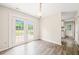 Dining area features french doors to backyard and stylish gray wood flooring at 2309 Hoot Owl Ct, Raleigh, NC 27603