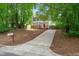Traditional two-story home with a red front door and long driveway at 2309 Hoot Owl Ct, Raleigh, NC 27603
