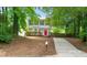 Charming two-story home featuring a bright red front door, blue shutters, and a well-manicured front yard at 2309 Hoot Owl Ct, Raleigh, NC 27603