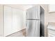 Kitchen with stainless steel refrigerator and lots of pantry space at 2309 Hoot Owl Ct, Raleigh, NC 27603