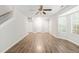 Spacious living room with wood flooring, multiple entry doors, and a window for natural light at 2309 Hoot Owl Ct, Raleigh, NC 27603