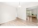 Open-concept room with modern wood floors and lots of natural light at 2309 Hoot Owl Ct, Raleigh, NC 27603