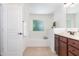 Bright bathroom featuring a soaking tub and a vanity with granite countertops at 233 Hammond Wood Place, Morrisville, NC 27560