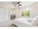 Comfortable bedroom with neutral carpet and decor, a ceiling fan and a work station at 233 Hammond Wood Place, Morrisville, NC 27560