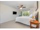 Comfortable bedroom with neutral carpet and decor and a ceiling fan at 233 Hammond Wood Place, Morrisville, NC 27560