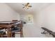 Spacious bonus room area with neutral carpet, a ceiling fan and a table at 233 Hammond Wood Place, Morrisville, NC 27560