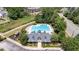 Aerial view showcasing the community pool and amenities, including a playground and clubhouse at 233 Hammond Wood Place, Morrisville, NC 27560