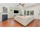 Cozy living room featuring a fireplace, abundant natural light, and hardwood floors at 233 Hammond Wood Place, Morrisville, NC 27560
