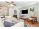 Inviting living room with fireplace, hardwood floors, and a comfortable seating area perfect for relaxation at 233 Hammond Wood Place, Morrisville, NC 27560