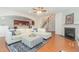 Spacious living room offering hardwood floors, a fireplace, and an open layout leading to the kitchen at 233 Hammond Wood Place, Morrisville, NC 27560