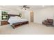Spacious main bedroom suite with ceiling fan and large windows at 233 Hammond Wood Place, Morrisville, NC 27560
