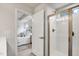 Bathroom with a glass shower door and a view into the main bedroom at 240 Amber Acorn Ave, Raleigh, NC 27603
