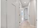 Hallway with white trim and doors and light carpet at 240 Amber Acorn Ave, Raleigh, NC 27603