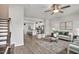 Open-concept living room flows into a kitchen with a breakfast bar and stainless steel appliances at 240 Amber Acorn Ave, Raleigh, NC 27603